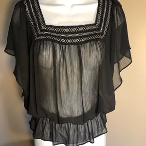 Black embroidered square neck line with design.